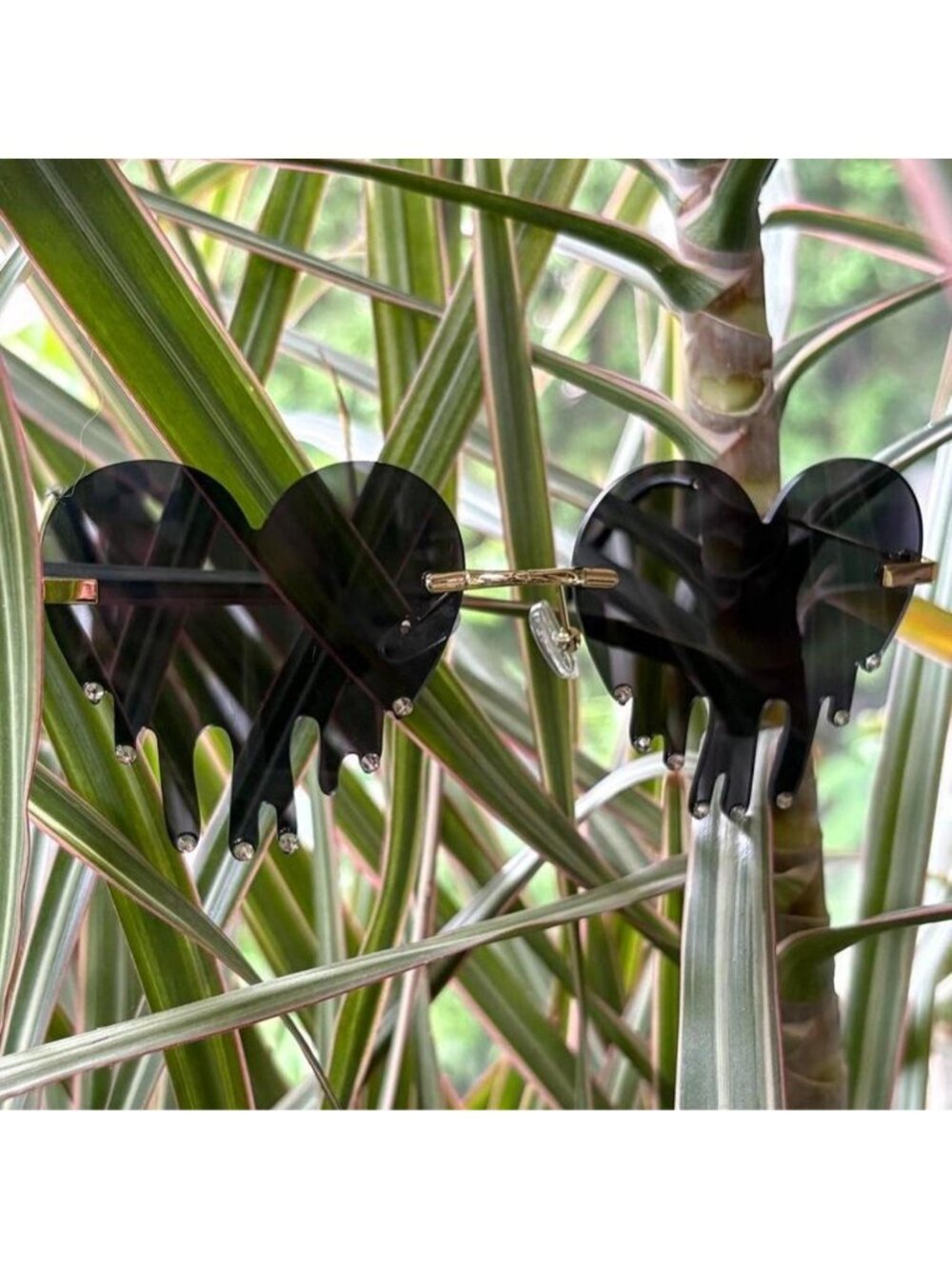 Black dripping heart tinted sunglasses with rhinestones